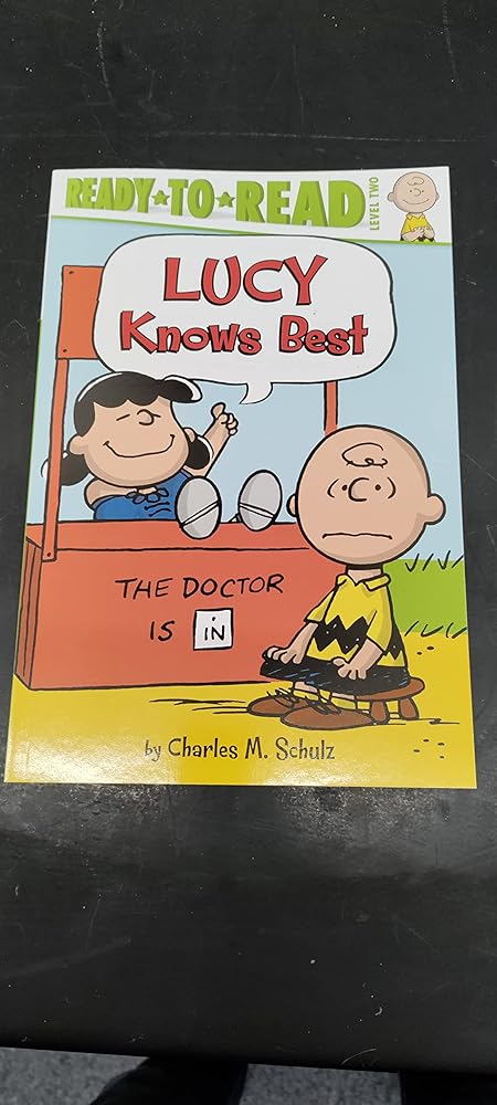 Ready to Read Level 2: Lucy Knows Best Paperback Book cover image